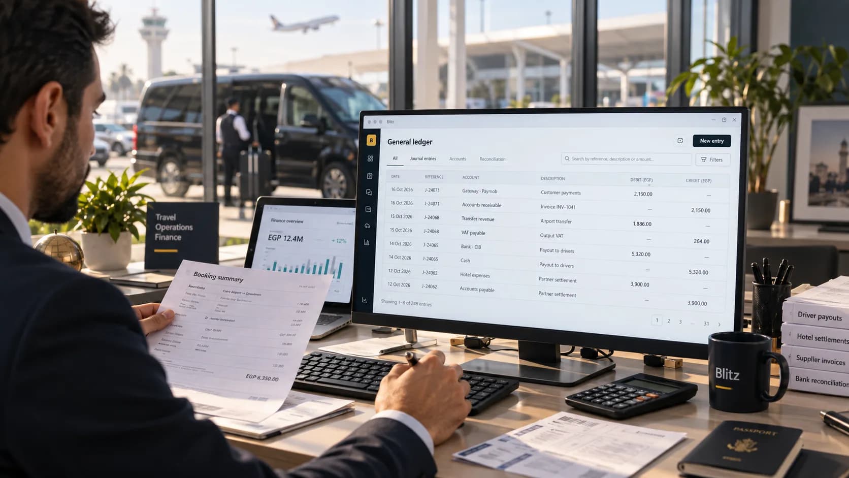 An accountant checking a booking summary against the general ledger's journal entries on screen